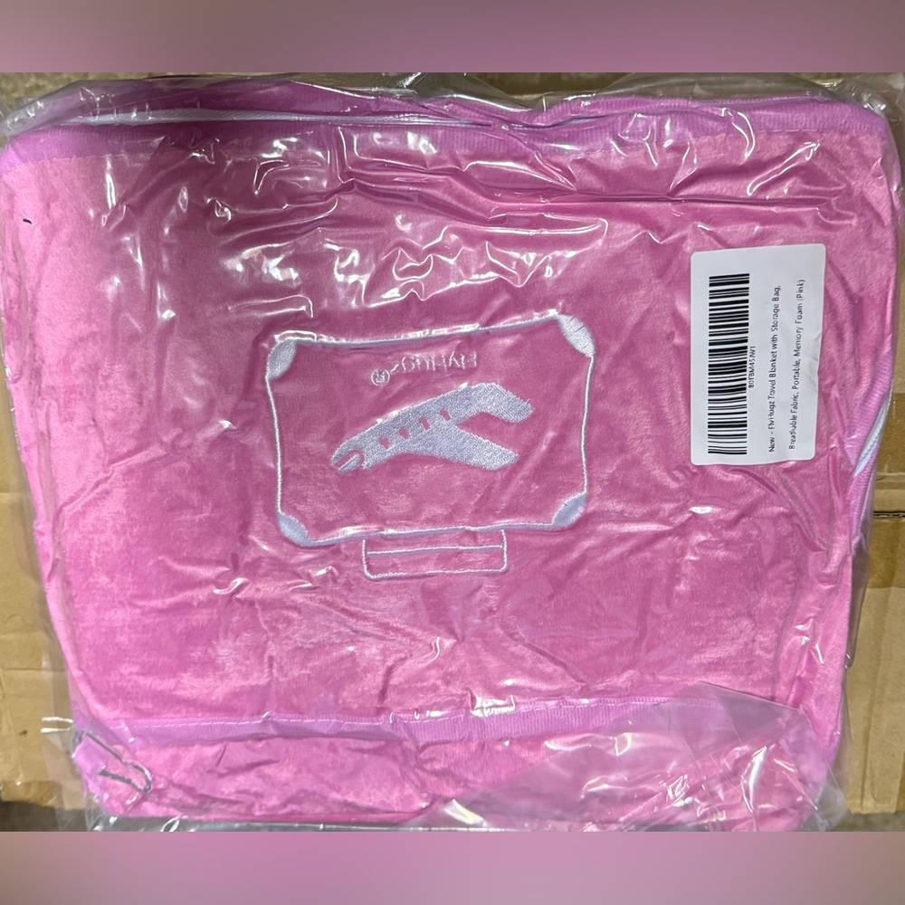 Fly Hugz Pink Travel Blanket with storage bag.